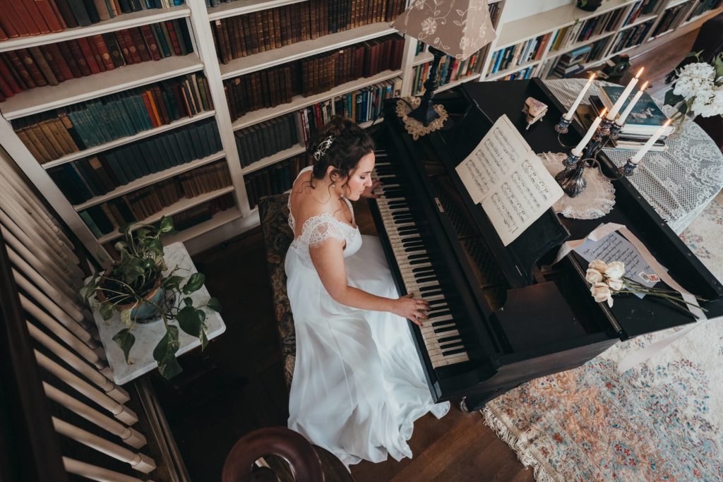 Overhead image of bride playing a piano