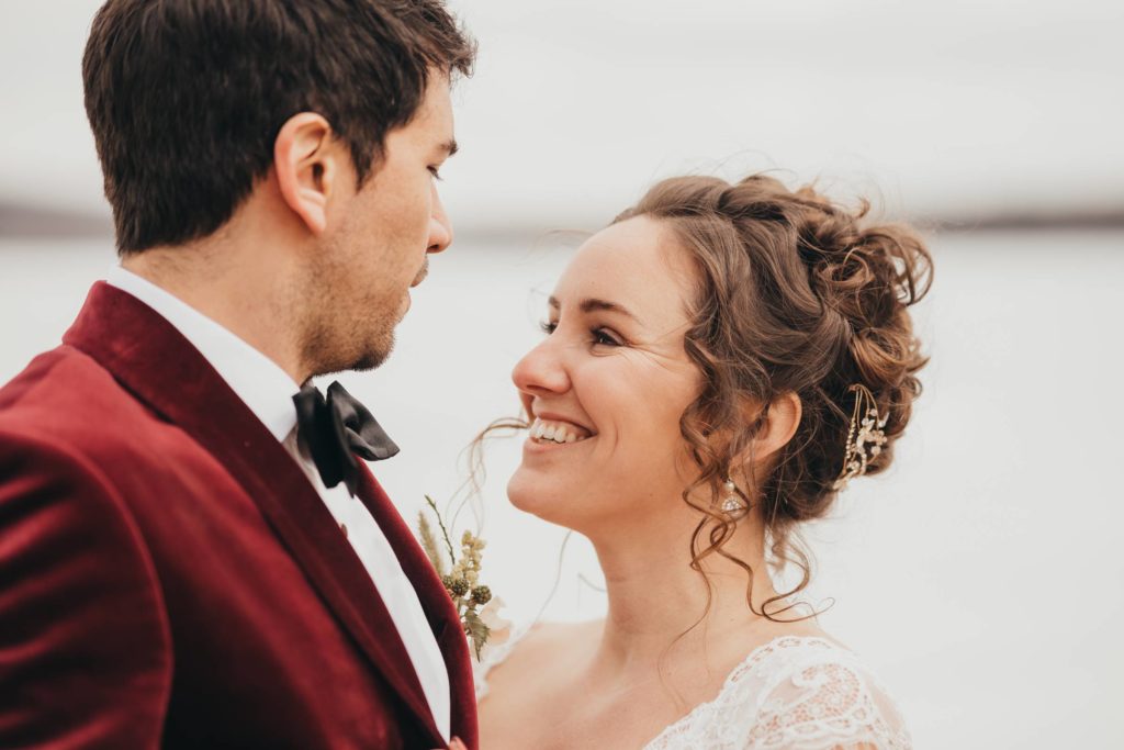 Close up image of bride smiling at groom