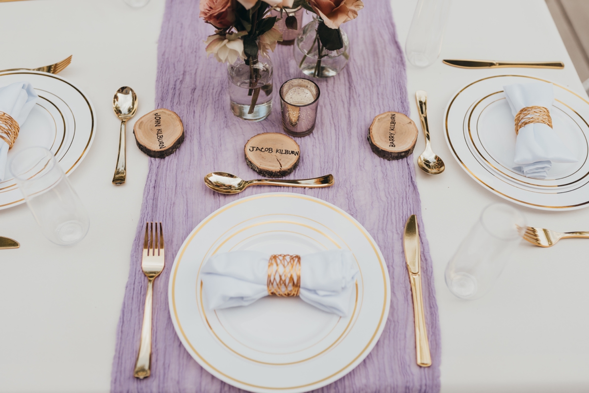 Backyard wedding reception with lavender, cream, and wood accents