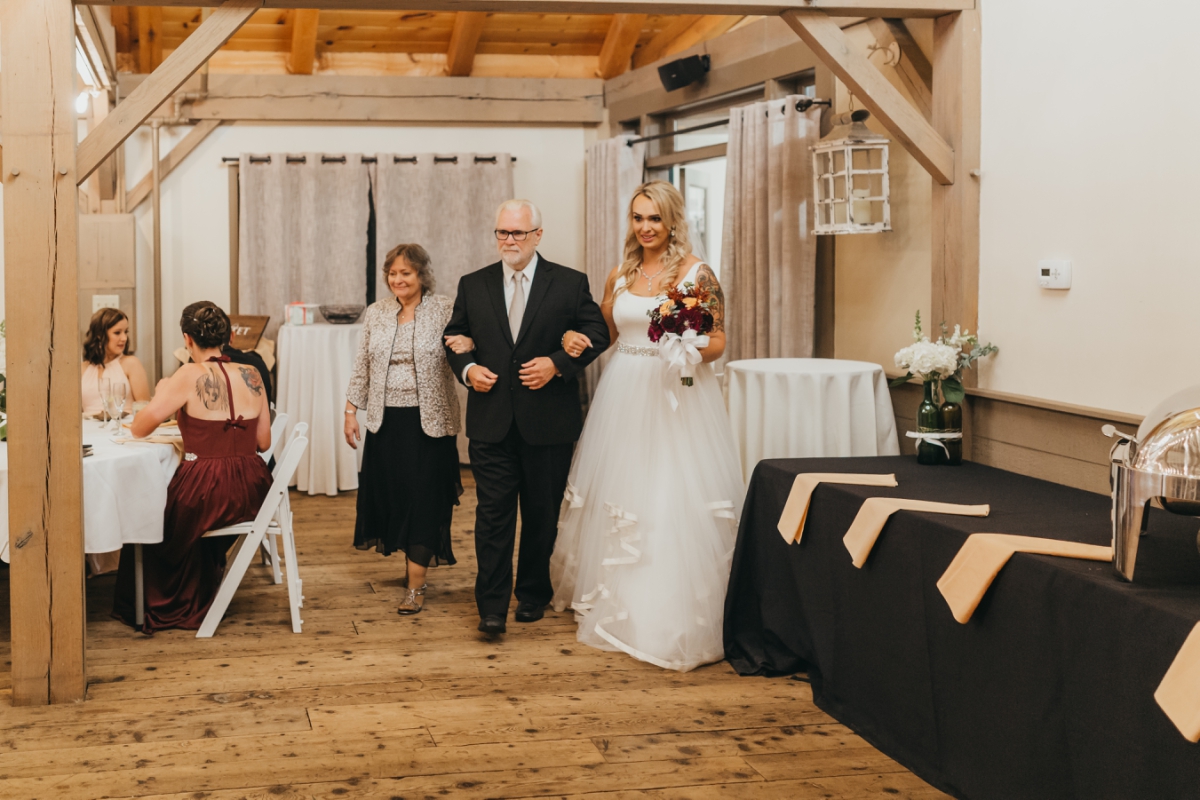 bride walked down aisle by parents at The Barn at Wight Farm