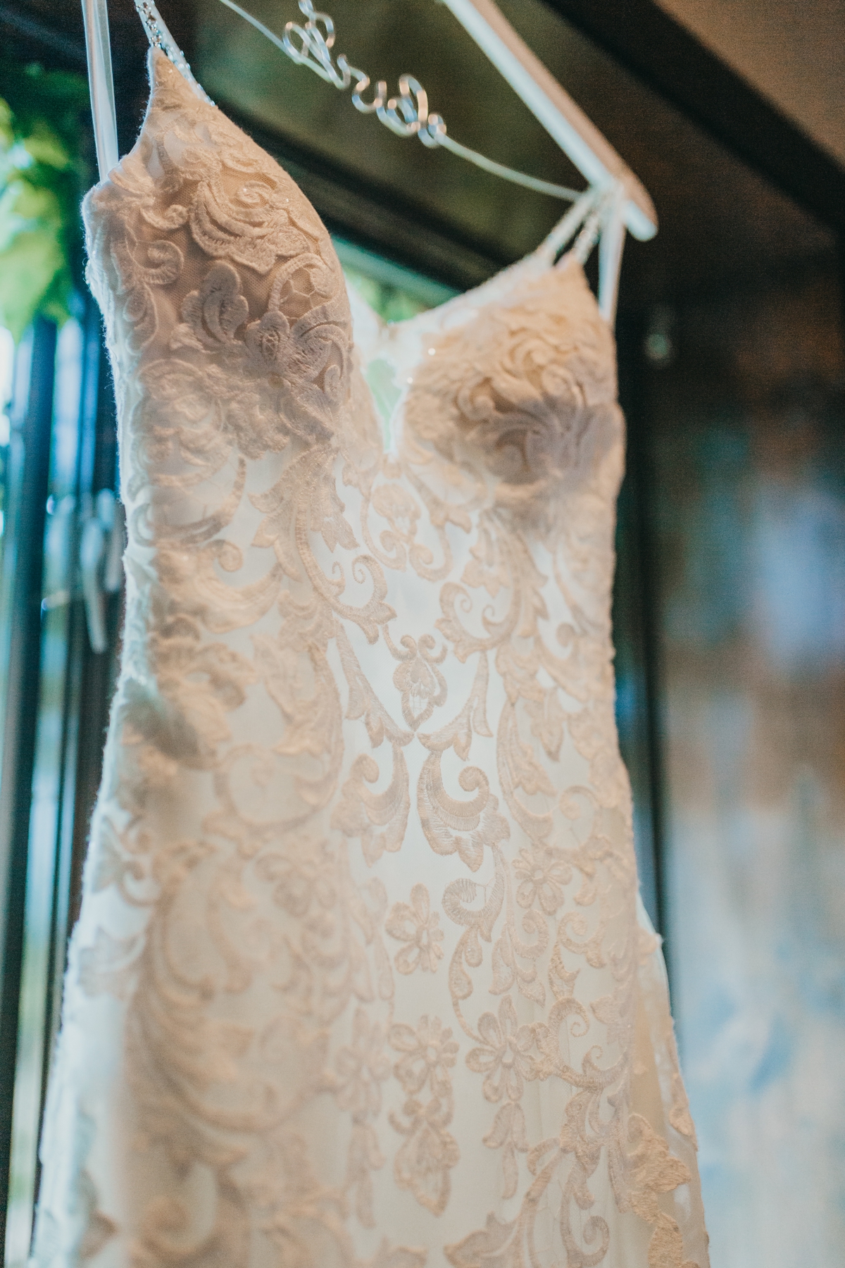Bride in a lace trumpet gown by Madeline Gardner