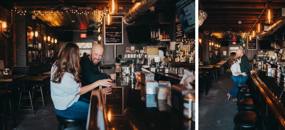 A couple laughing and snuggling at the bar counter.