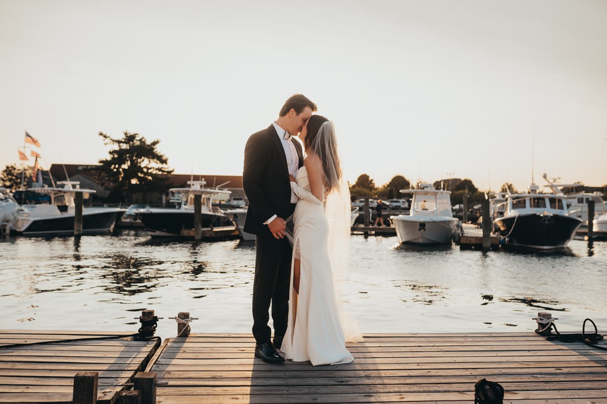 Couple kisses in sunset portrait in Newport Rhode Island